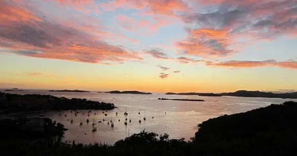 Pink evening sky over boats in a Virgin Islands harbor