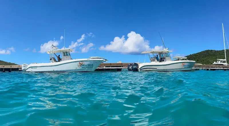 On the Sea Charters boats in clear blue water